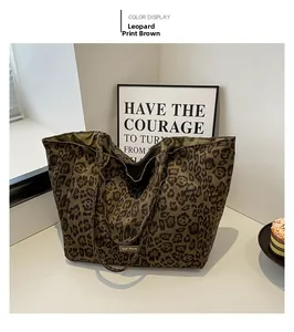 Macro shot of large leopard print tote bag with brown pattern and olive green lining