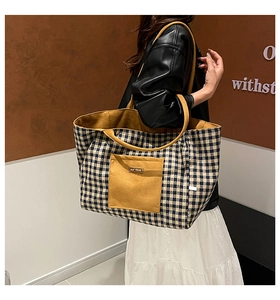Detail of checkered canvas tote bag with ginger yellow pocket and contrast strap