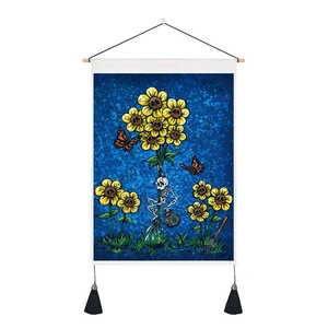 Detail of gothic skull sunflower tapestry with skeleton figure and black tassels
