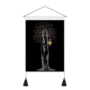 Detail of mystical moon girl wall tapestry featuring gold runes and black tassels