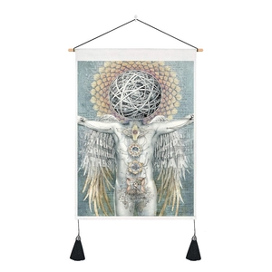 Modern white wall tapestry with spiritual motifs, wooden rod, and black fringe tassels