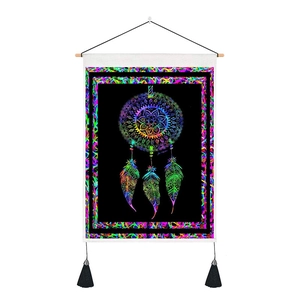 Bohemian dreamcatcher tapestry with neon patterns on black fabric and wooden rod