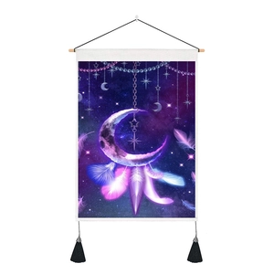 Detail of Bohemian dreamcatcher tapestry with celestial moon and glowing feathers
