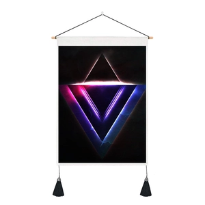 Detailed close-up of neon geometric triangle wall tapestry with tassels and wooden rod