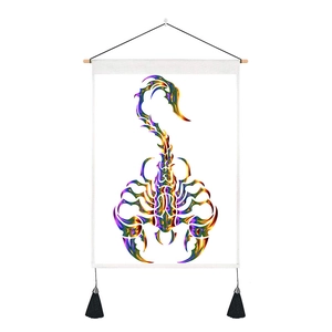 Close-up of Scorpio tapestry with metallic scorpion print, wooden pole, and black tassels