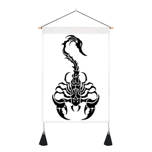 Macro shot of scorpio tapestry featuring tribal print, wooden pole, and black tassels