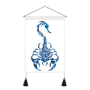 Detail of Scorpio tapestry with blue metallic totem, wood hanging rod and black tassels