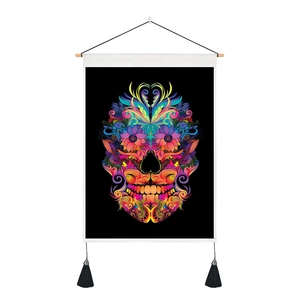 Detail of bohemian sugar skull tapestry with colorful patterns and black corner tassels