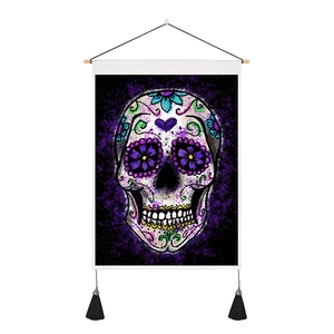 Detail of sugar skull tapestry with dark nebula background and black tassel accents