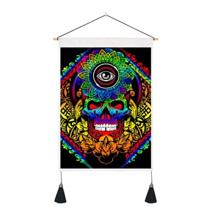 Detail of bohemian skull tapestry with tassels and mandala third eye design