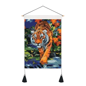 Detail of tiger tapestry with wooden hanger, black tassels and high-density fabric texture