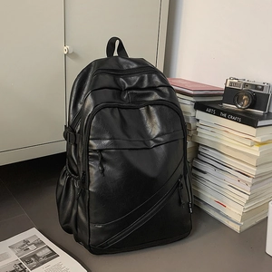 Men's minimalist black leather laptop backpack for business travel and daily school use