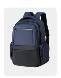 Close-up of the USB charging port and breathable padded back of the blue backpack