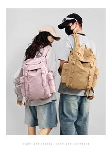 Outdoor 25L travel backpack showing waterproof nylon texture and functional side straps