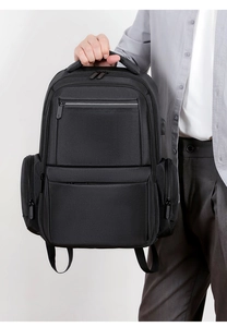Detailed view of durable black business backpack with multi-pocket and thick handle