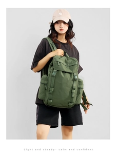 Outdoor 25L military green backpack with multiple utility buckles and side pockets