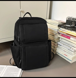 Close-up of durable black business backpack with large zipper pockets for daily commute