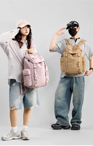 Detail of multi-pocket outdoor backpacks with adjustable straps and flap top closure
