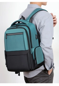 Detail view of business casual backpack with USB charging port and multi-zipper pockets