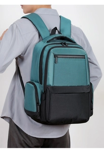 Rear side view of ergonomic padded straps and multi-pocket design on the blue business backpack