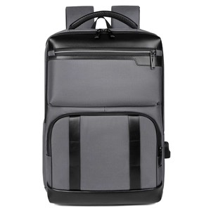 Business travel backpack in charcoal grey and black leather with external USB port