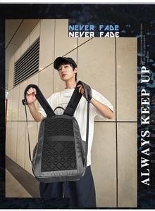 Detail of grey business laptop backpack with geometric pattern and padded mesh straps