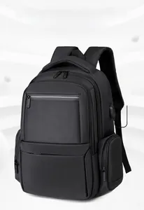Detail of waterproof black multi-compartment backpack with integrated USB charging port
