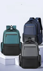Business commuter backpacks in navy blue, dark grey, and forest green with USB port