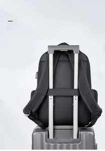 Business laptop backpack with luggage strap and USB charging port on a trolley handle