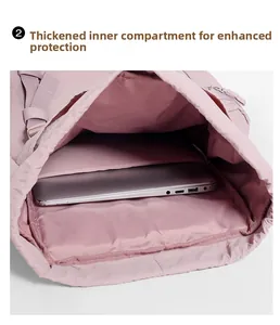 Close-up of the 25L pink hiking backpack featuring a padded 14-inch laptop compartment
