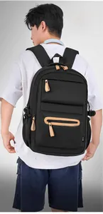 Detail view of durable nylon backpack with layered zipper pockets and side buckles