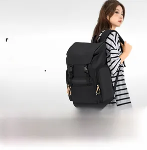 Detail of waterproof nylon backpack showing side pocket and durable buckle closure