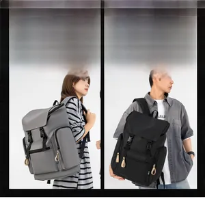 Detail view of large-capacity nylon backpacks with flap buckles and leather zipper pulls