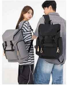 Detail view of large capacity street style backpacks with flap buckles and zipper pockets