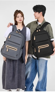 Detail view of large capacity waterproof nylon backpacks in black and grey for students