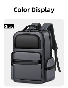 Detail view of large grey business backpack showing padded straps and multi-layer zippers