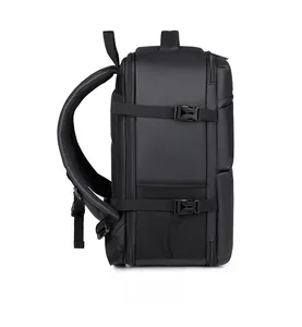 Close-up of black travel backpack side view showing mesh pocket and compression straps