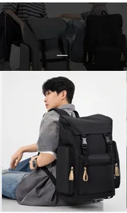Detail of durable black urban backpack featuring buckle closure and leather accents