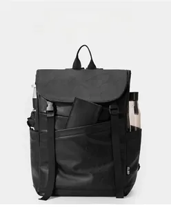 Detail view of black vintage laptop backpack with multiple storage pockets for daily travel