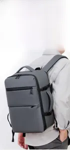 Side view of dark grey waterproof travel backpack with large capacity and reinforced buckles