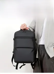 Business laptop backpack detail showing ergonomic side handle and durable waterproof fabric