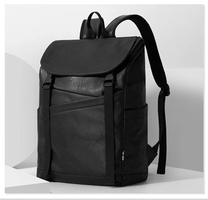 Close-up of black faux leather texture and buckle closure on retro business backpack