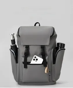 Detail of dark grey backpack side pockets showing storage for umbrella and water bottle