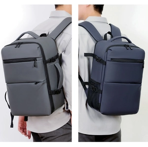 Detailed comparison of gray and navy blue water-resistant nylon business backpacks