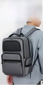 Detailed view of grey business backpack with multi-layer compartments for travel and work
