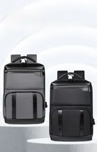 Close-up of gray and black expandable business backpacks on stone pedestals