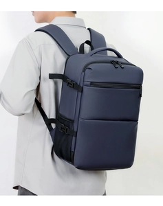 Side view of dark blue business backpack with ergonomic straps and adjustable buckles