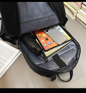 Interior layout of business laptop backpack with multiple compartments and elastic strap