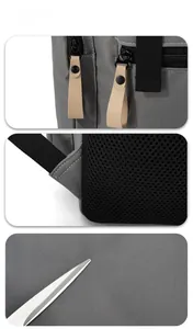 Detail view of durable gray fabric, breathable mesh padding and double zipper of the backpack