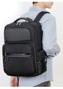 Side view of large business laptop backpack for men in premium black leather and nylon